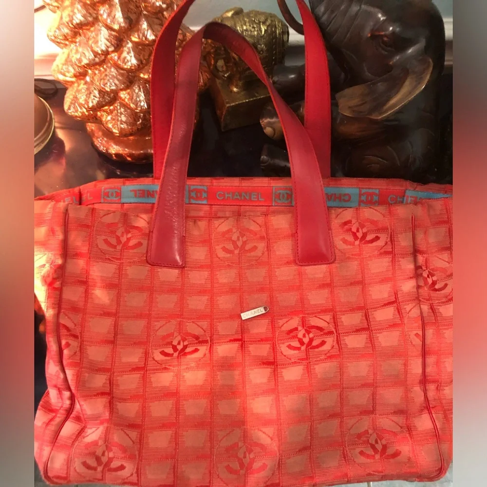 CHANEL Red Quilted Tote Bag with Embossed Logo